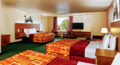 Marquis Studio Suite at Grand Marquis Hotel with 3 queen beds, mini fridge, and HD TV - view when inside the room towards the window
