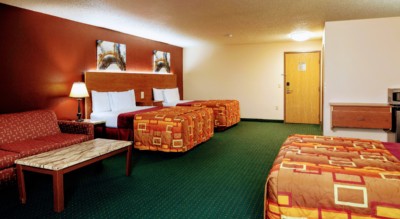Marquis Studio Suite at Grand Marquis Hotel with 3 queen beds, mini fridge, and HD TV - view when inside the room towards the entrance