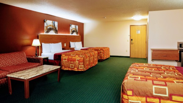 Marquis Studio Suite at Grand Marquis Hotel with 3 queen beds, mini fridge, and HD TV - view when inside the room towards the entrance